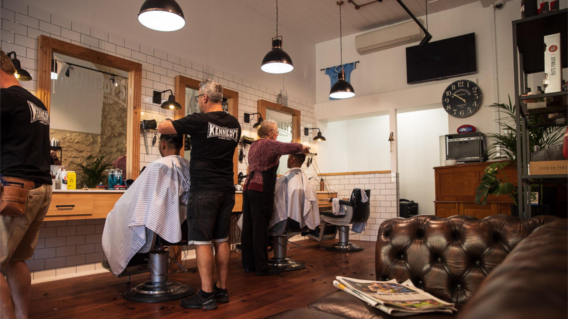About-Page-The-Difference Staff Cutting Hair at Kennedy's Barbershop